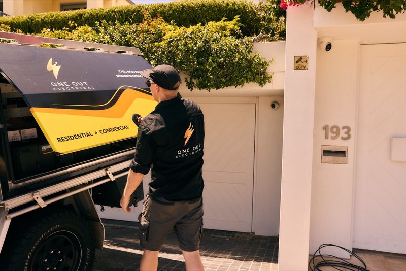 One Out Electrical service vehicle outside a residential address — local electrician Hobart