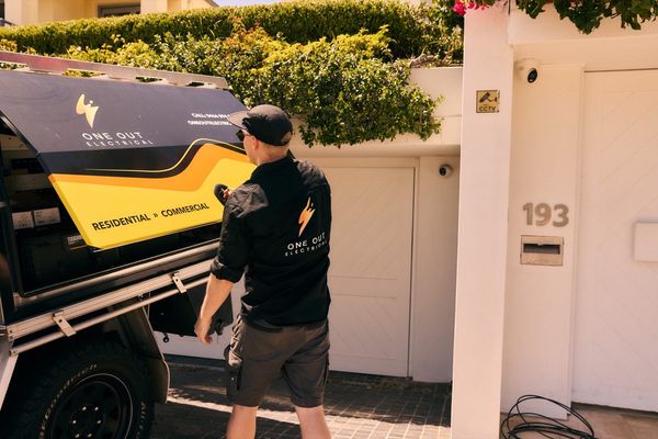 One Out Electrical service vehicle outside a residential address — local electrician Hobart