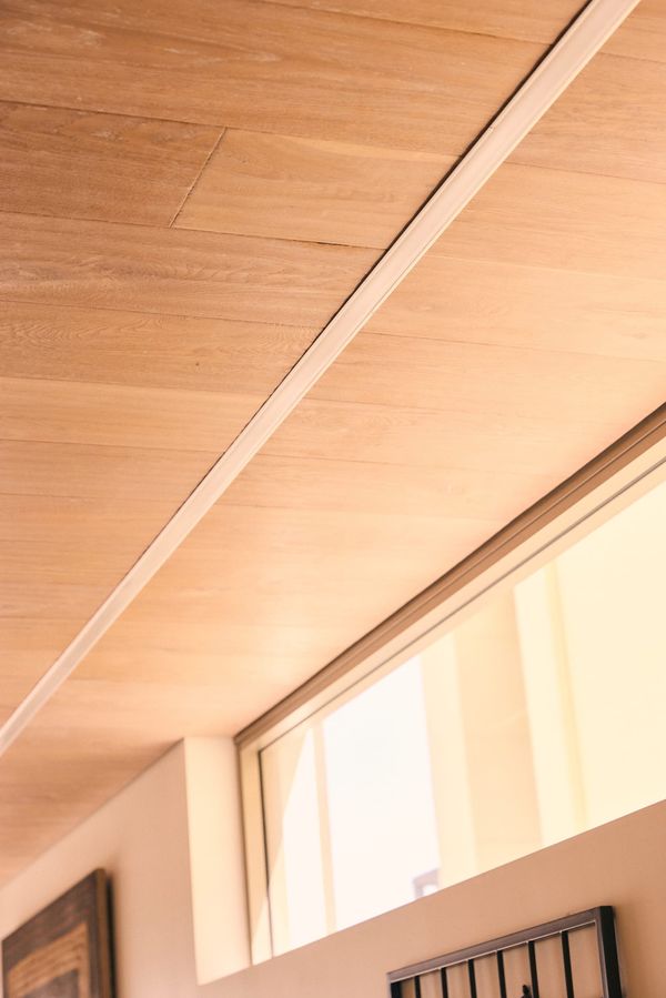 Completed recessed LED lighting track in a timber ceiling — smart lighting installation result