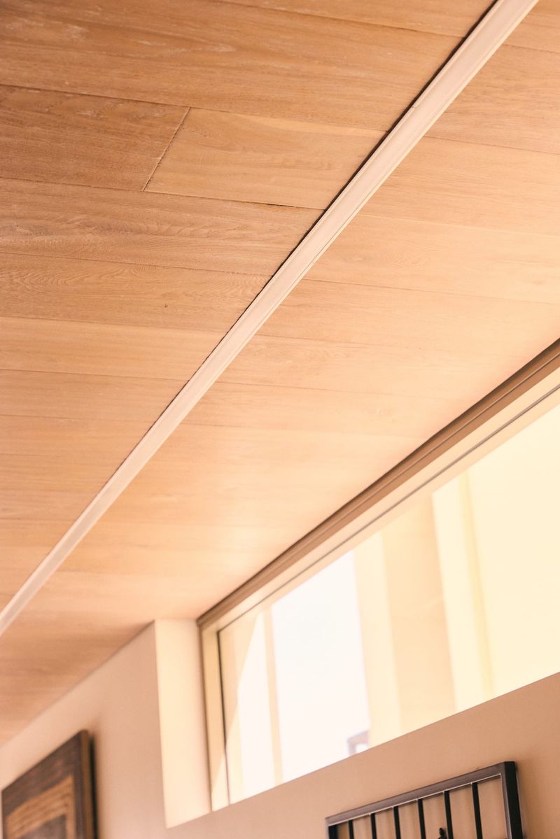 Completed recessed LED lighting track in a timber ceiling — smart lighting installation result