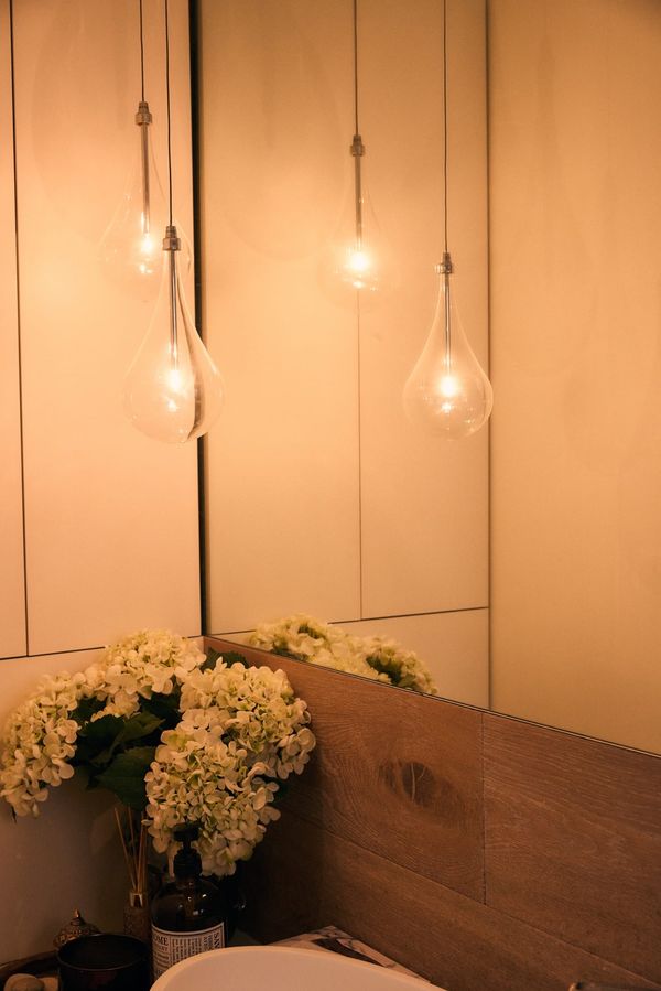 Decorative glass teardrop pendant lights installed above a bathroom vanity — One Out Electrical