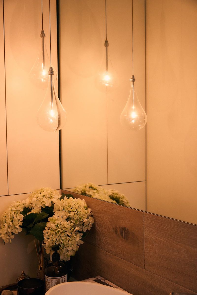 Decorative glass teardrop pendant lights installed above a bathroom vanity — One Out Electrical